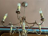 a chandelier hanging from the ceiling in a room