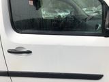 a car with a stuffed animal in the window of it