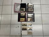 a lot of pictures on the floor of this room