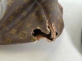 a brown bag with a hole in it sitting on a table