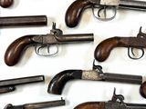 a lot of old guns that are on the table