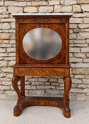 a small wooden cabinet with a mirror on it
