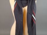 black scarf with red and white stripes on it on a mannequin