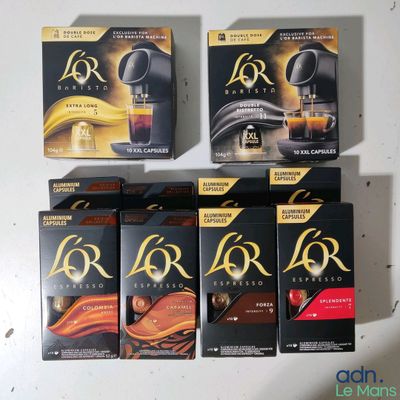 four boxes of coffee sit next to each other on a table