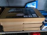 many boxes of electronics on a shelf in a store