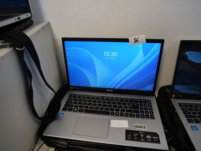 two laptops sitting next to each other on a desk