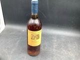a bottle of wine that is sitting on a counter