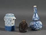 three small vases sitting next to each other on a table