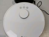 a white robot that is sitting on a table