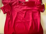 a red shirt sitting on a white table