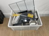 a white container filled with electronic equipment on a wooden floor