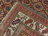 two rugs with different colors and patterns on them on the floor