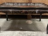 an image of a black table with a leather top and legs