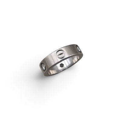 a close up of a ring on a white surface