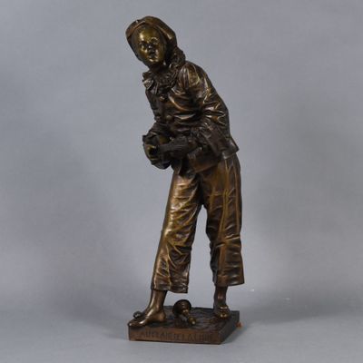 bronze statue of a woman holding a basket of flowers on a base