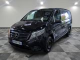 the mercedes van is parked on a checkered floor in a garage