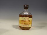 a small bottle of rum sitting on a table