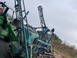 a tractor that is sitting on the side of the road