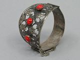 silver bracelet with red coral beads and chain