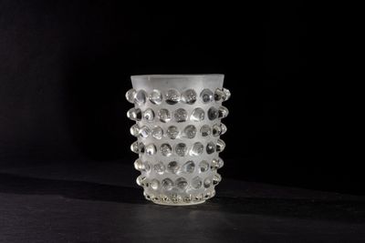 a glass vase that is sitting on a table