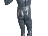 statue of a man standing on a wooden base with his hands in the air
