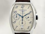 une photo d'une montre Longines avec un cadran blanc et un bracelet en cuir marron