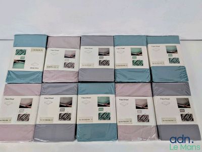 several boxes of bedding are stacked on top of each other