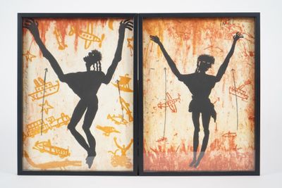 two framed silhouettes of a man and a woman with their arms up