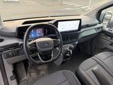 the interior of a car with a steering wheel, dashboard, and dashboard screen