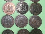 six different types of coins are shown on a green surface