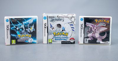 Trois jeux Nintendo Wii sont alignés sur une table