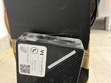 a black suitcase sitting on the floor next to a black suitcase