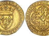 a gold coin with a shield on the front and a shield on the back
