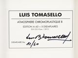 the label of a bottle of liquid with a signature on it