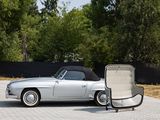 an image of a silver convertible car parked in a parking lot