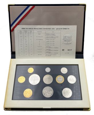 an open book with coins in it on a white surface
