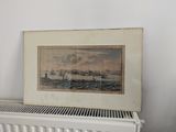 une photo d'un tableau posé sur un radiateur, à côté d'un radiateur