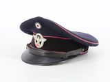 navy officer ' s cap with pink trim on a white background