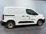 a white van that is parked in a garage