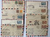 two old envelopes with stamps on them sitting on a table