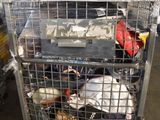a metal cage filled with lots of items in a warehouse