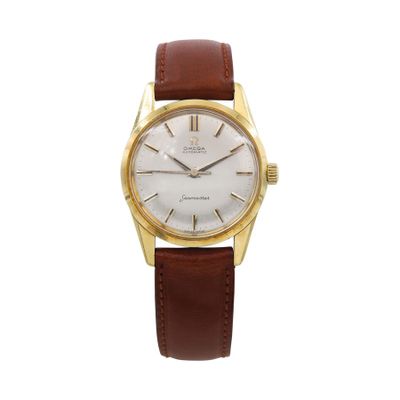a gentleman ' s gold plated wrist watch with white dial and brown leather strap