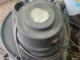 a machine that is sitting on the floor next to some wires