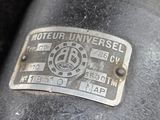 a close up of a motor that has a metal plate on it