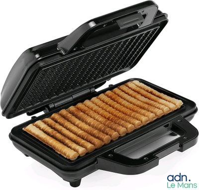 a close up of a waffle maker on a white background