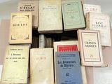 a lot of books that are sitting on a table