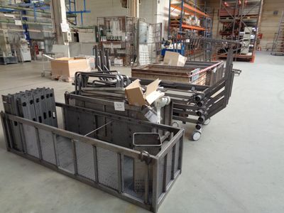 a large warehouse with a lot of metal items on the floor