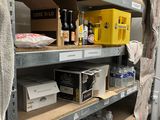 a shelf with many items on it in a room