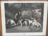 une vieille photo représentant un homme et deux chiens dans une pièce