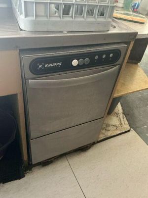 a dishwasher sitting on the counter in the kitchen